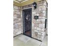 Close-up showcasing the stone facade around the main entrance of the home at 2355 Villa Oaks Ct, Gastonia, NC 28054