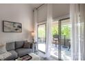 Relaxing seating on the covered balcony providing an outdoor space that overlooks the yard and trees at 2504 Stradbrook Dr # B, Charlotte, NC 28210