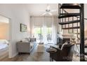 Cozy living room with fireplace, comfortable seating, and access to a private deck with outdoor views at 2504 Stradbrook Dr # B, Charlotte, NC 28210
