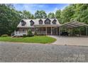 Charming brick home with a metal roof, covered porch, and convenient carport on a well-maintained lot at 32060A Flint Ridge Rd, Albemarle, NC 28001