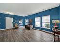 Inviting living room with hardwood floors, natural light, and comfortable seating at 656 Hosta Dr, Fort Mill, SC 29715