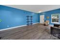 Spacious living room features hardwood floors, neutral paint, and ample natural light at 656 Hosta Dr, Fort Mill, SC 29715