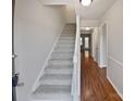 Carpeted staircase leading to the upper level with views of the hallway at 8026 Regent Park Ln, Charlotte, NC 28210