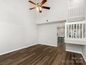 Spacious living room boasts soaring ceilings, laminate flooring, and a cozy ceiling fan at 12954 Sickles Dr, Charlotte, NC 28273