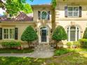 Inviting home exterior with a well-maintained lawn, manicured shrubbery, and a welcoming entrance at 15618 Eagleview Dr, Charlotte, NC 28278
