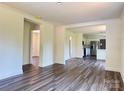 Bright, open-concept living area featuring modern flooring and a seamless flow to the kitchen at 159 Hallman St, Cherryville, NC 28021