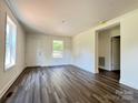 Inviting living room featuring hardwood floors, neutral paint, and bright windows at 159 Hallman St, Cherryville, NC 28021