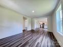 Spacious living room featuring wood-look floors and ample natural light at 159 Hallman St, Cherryville, NC 28021