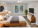 Cozy bedroom featuring a large window, stylish furnishings, and a comfortable atmosphere at 1625 Winthrop Ln, Monroe, NC 28110