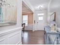 Bright foyer with hardwood floors and elegant decorative details at 2014 Burton Point Ct, Waxhaw, NC 28173