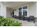 Inviting front porch with comfortable seating and a charming welcome sign at 2014 Burton Point Ct, Waxhaw, NC 28173