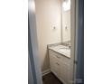 This powder room features a white vanity, granite countertop, and a chrome faucet at 206 N Kayla Dr, Salisbury, NC 28146