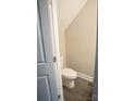 This powder room features a single toilet and luxury vinyl plank flooring at 206 N Kayla Dr, Salisbury, NC 28146