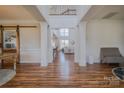 Elegant foyer with hardwood floors, high ceilings, and an open view to the living area at 2380 Fairport Se Dr, Concord, NC 28025