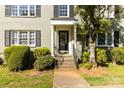 Charming condo building with mature landscaping, a cozy entrance, and lovely windows at 241 Wakefield Dr # C, Charlotte, NC 28209