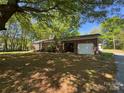 Charming brick home with attached garage and mature trees at 2703 34Th Street Ne Pl, Hickory, NC 28601