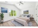 Bright bedroom with a large window, light wood floors, and neutral-toned decor at 3048 Goble St, Gastonia, NC 28056