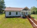 Charming home featuring a welcoming front porch with wooden accents and a well-manicured lawn at 3121 Suffolk Dr, Shelby, NC 28152