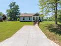 Charming single-story home with a walkway with landscaping, a nice sized yard, and a quaint covered porch at 3121 Suffolk Dr, Shelby, NC 28152