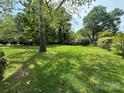 Expansive backyard with mature shade trees, perfect for outdoor activities at 404 S Mulberry St, Cherryville, NC 28021