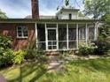Enclosed back porch that gives the home space for outdoor relaxation at 404 S Mulberry St, Cherryville, NC 28021