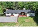 An aerial view showing the home's layout, updated roof, and surrounding landscape at 4110 Charles Raper Jonas Hwy, Alexis, NC 28006