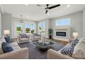 Stylish living room with fireplace, ceiling fan, and tastefully arranged furniture at 424 Fulton Dr, Kings Mountain, NC 28086