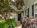 Charming front entrance with landscaped walkway and mature plantings at 5304 Silabert Ave, Charlotte, NC 28205