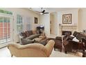 Comfortable living room with a fireplace, plush seating, and ample natural light at 6133 Wakehurst Rd, Charlotte, NC 28226