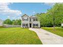 Two-story home with gray siding and black shutters with a well-manicured front lawn at 759 Victory Gallop Ave, Clover, SC 29710