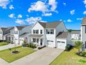 Charming two-story home with a well-manicured lawn, and a two-car garage at 109 Fairfield Dr, Troutman, NC 28166