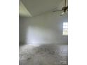 Bright bedroom with white walls, vaulted ceiling, a ceiling fan, and a window offering natural light at 13933 Eden Ct, Pineville, NC 28134