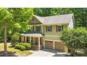 Charming two-story home with a well-manicured lawn, two-car garage, and inviting front porch at 2417 Labelle Dr, Waxhaw, NC 28173