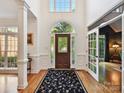 Grand foyer featuring hardwood floors, high ceilings, and elegant detailing at 3519 Weddington Oaks Dr, Matthews, NC 28104