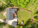 Aerial view of a house featuring a large, fenced yard, a shed, a deck, and a carport at 4050 Leafmore St, Concord, NC 28027