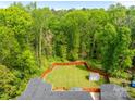 Aerial view of a large, fenced backyard with shed and deck at 4050 Leafmore St, Concord, NC 28027