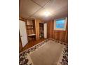 Cozy finished basement with wood paneling, carpet, storage, and a closet space at 406 S Caldwell Ave, Newton, NC 28658