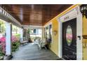 Inviting covered front porch with a seating area and a view of the front yard at 505 S South St, Gastonia, NC 28052
