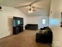 Spacious living room featuring vaulted ceiling, neutral paint, and comfortable seating arrangement at 5065 Gateway Dr, Claremont, NC 28610