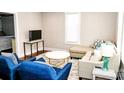 Inviting living room featuring a cozy seating arrangement and natural light at 606 Childs St, Lincolnton, NC 28092