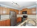 Well-equipped kitchen featuring stainless steel appliances and granite countertops at 867 Southwest Dr, Davidson, NC 28036