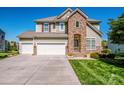 Charming two-story home with a well-maintained lawn and three-car garage, blending stone and siding details at 9860 Darby Creek Nw Ave, Concord, NC 28027