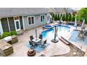 Backyard with pool, hot tub, outdoor kitchen and patio area for relaxing and entertaining at 1215 39Th Ne Ave, Hickory, NC 28601