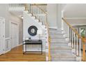 Elegant foyer with a staircase, hardwood floors, and decorative accents at 1305 Foxfield Rd # 60, Waxhaw, NC 28173