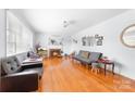 Bright living room with hardwood floors and a cozy fireplace at 1307 Armstrong Rd, Belmont, NC 28012