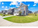 Lovely two-story home with a manicured lawn, two-car garage, and inviting curb appeal at 13547 Roderick Dr, Huntersville, NC 28078