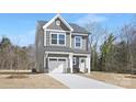 Inviting two-story home with gray siding, white trim, and a well-maintained front yard at 2129 Tom Sadler Rd # 7160, Charlotte, NC 28214