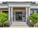 Welcoming front entrance with stylish double doors, stone steps, and classic architectural details at 2316 Westminster Pl, Charlotte, NC 28207