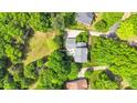 Aerial view of a home featuring a pool, patio, and mature trees at 2417 Hamilton Mill Rd, Charlotte, NC 28270