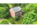 Aerial view of a brick home showing mature trees and manicured lawn at 2417 Hamilton Mill Rd, Charlotte, NC 28270